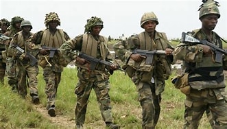 TROOPS EMBARK ON FRESH COUNTER-ATTACK ON TERRORISTS IN KADUNA , SEIZE GPMG, LARGE ARMS CACHE